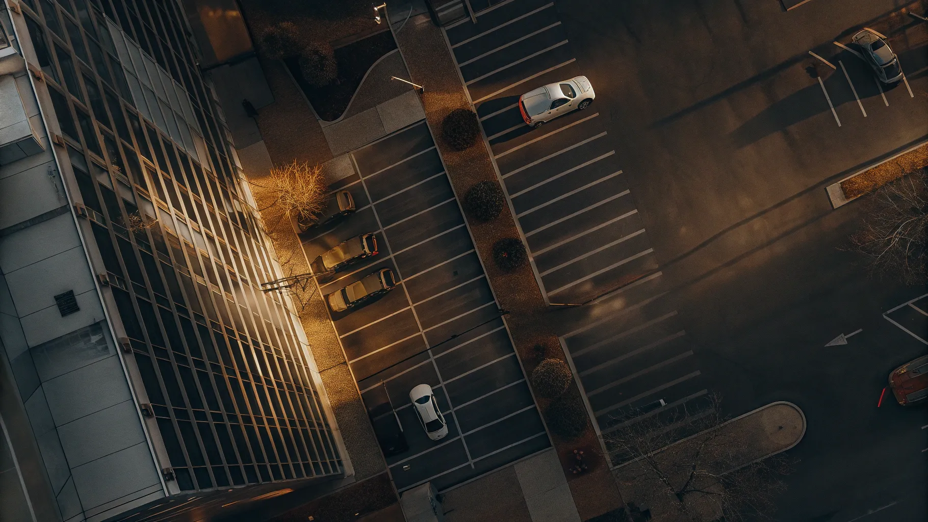 Aerial view of modern hospital building at dusk with warm golden light